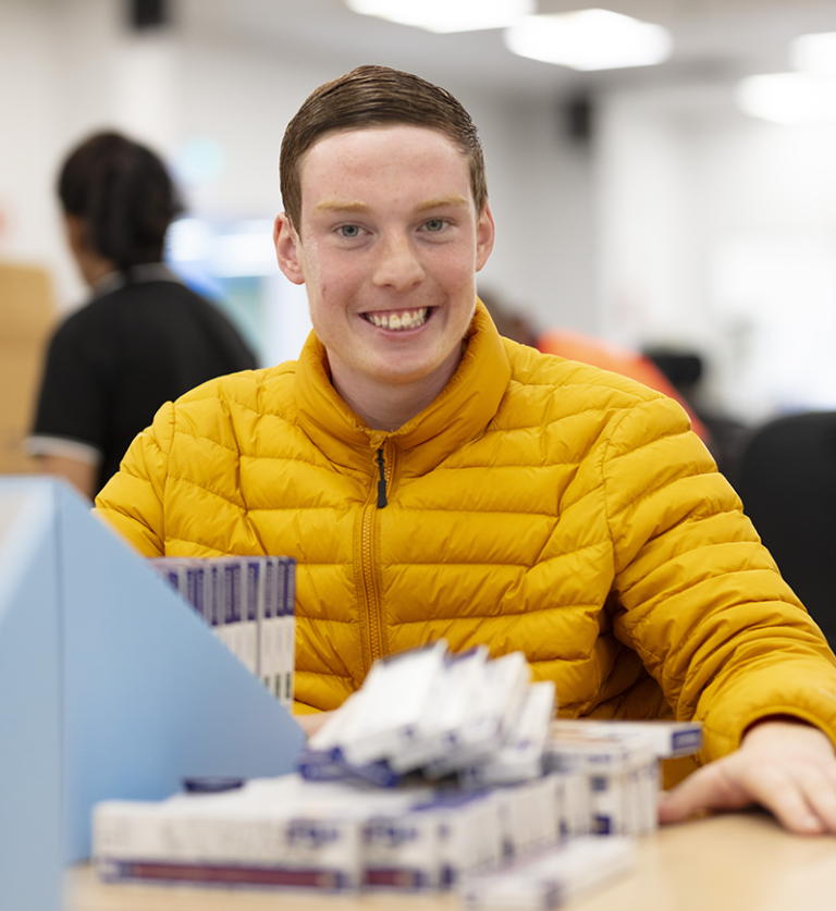 A Packforce supported employment team member working on a packing job for Staedtler