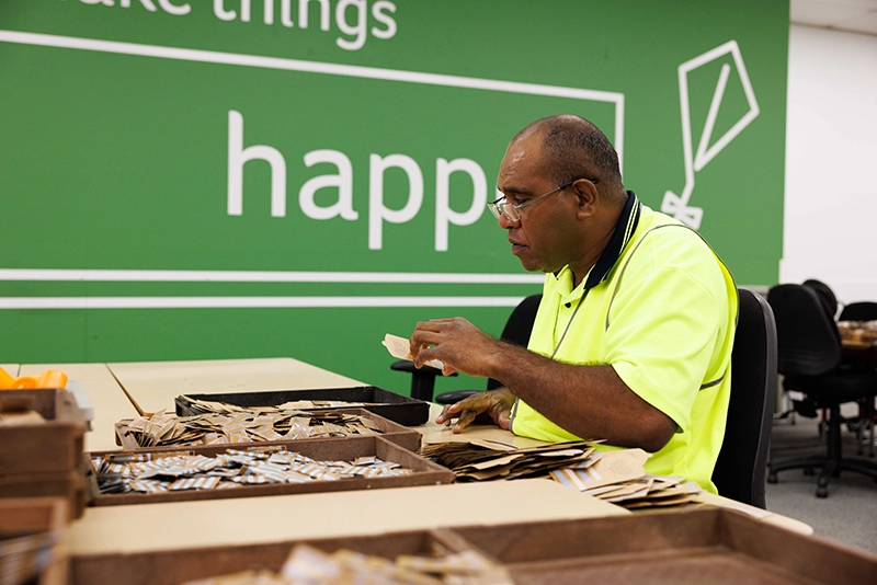A Packforce employee working on a packing job